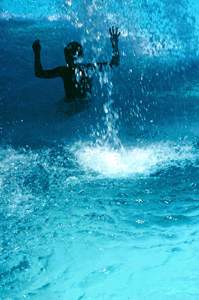 Child Splashing in the Crystal Clear Waters